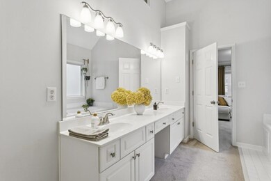 The Spa-Like Ensuite Bathroom boasts a Double Vanity, Soaking Tub, and Separate Shower.