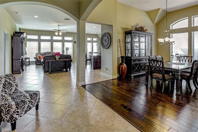 Large tiles flow from entry into open and spacious family area. Formal Dining room with wood floor and wall of windows are great features to enjoy meals together.