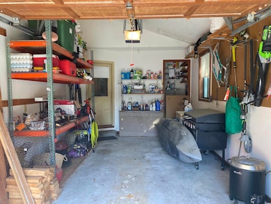 Garage featuring a garage door opener