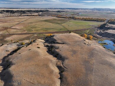 Aerial view featuring a rural view and a water vie
