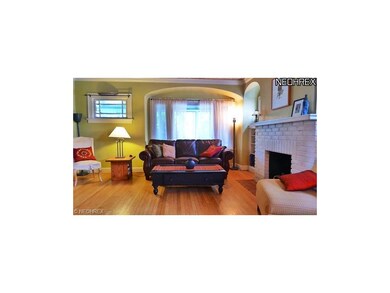 Nice sizxe living room with fireplace and hardwood