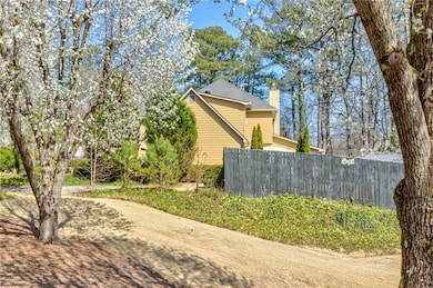 View of property exterior featuring a chimney