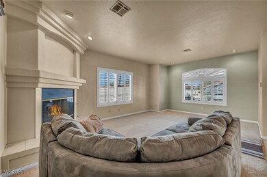 Living room with carpet flooring, plenty of natura