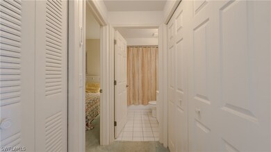Hallway to the 2nd Master Bedroom. Laundry area is