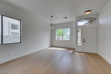 Entrance foyer featuring baseboards, visible vents