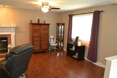 Open concept family room with section for another office or flex space.