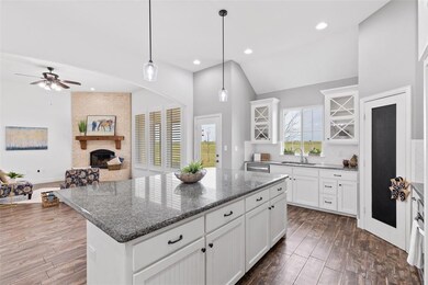 Large center island with black granite tops