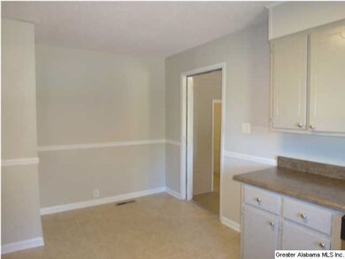 KITCHEN IS OPEN AND FEATURES AN EAT-IN SPACE TOO.