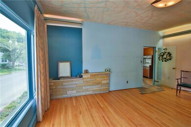 Large windows flood the Dining room with natural l