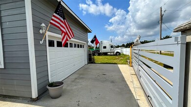 The property features a gated entrance and a well-