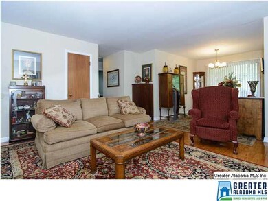 Hall off Living Room leads to Three Bedrooms