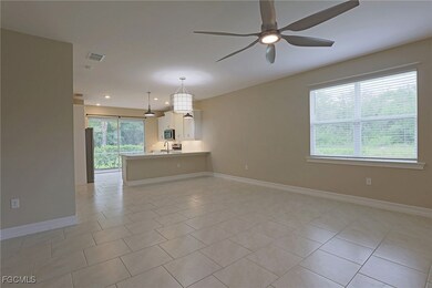 Unfurnished living room featuring a ceiling fan, l