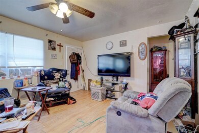 Living room featuring wood-type flooring and ceili