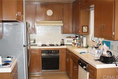 Kitchen with built-in oven and dishwasher.
