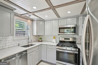 Designer Kitchen With Custom Soft-Close Cabinetry, Quartz Counters, & Stainless Steel Appliances