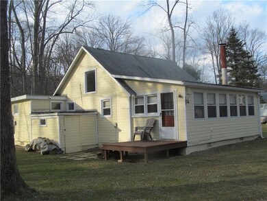 BACK SIDE OF COTTAGE FACING CREEK