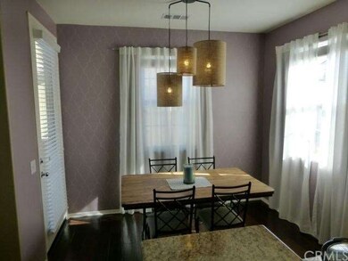 Eating Area with custom light fixture. Door to Bal