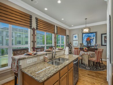 Kitchen opens to breakfast area