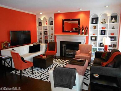 Living Room. Built in shelves, fireplace, tall ceilings and beautiful wood floors make for a wonderful ambiance in the living room.