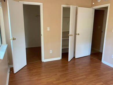 Unfurnished bedroom with a closet, a spacious clos