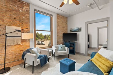 Living area featuring exposed brick