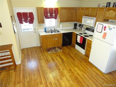 Kitchen contains lots of natural light and an eat-