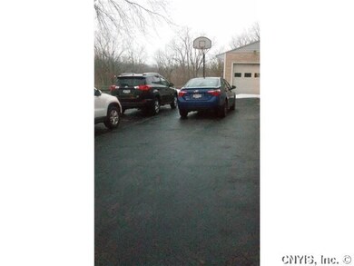 Exterior Front. Driveway holds up to six vehicles.