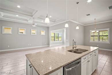 Kitchen featuring dishwasher, a sink, open floor p