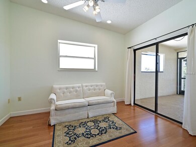Den with access to front screened porch