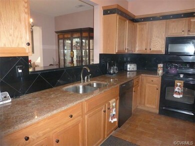 Granite Counter Tops and Black Diamond Tile Backsp
