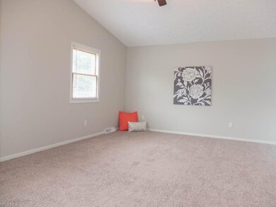 Master suite with vaulted ceilings, a private full