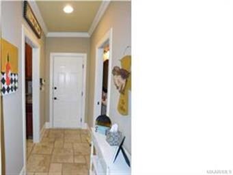 HALLWAY OFF OF KITCHEN LEADING TO THE TWO CAR GARA