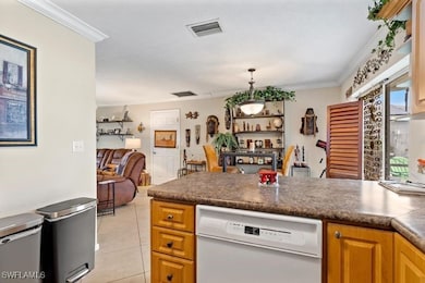 Kitchen featuring ornamental molding, decorative l