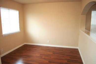 Unfurnished room featuring wood finished floors a