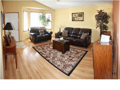 Bay window, lovely wood laminate flooring and vaul