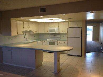 Family room, breakfast bar and kitchen