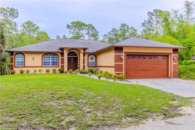 Ranch-style home with stucco siding, an attached g