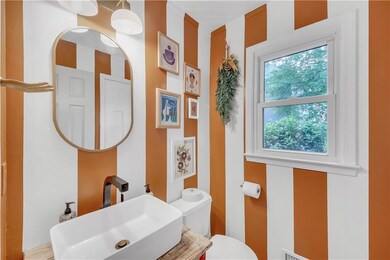 This is the Powder Room on the main level, just off the Family Rm & Kitchen