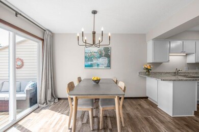Dining room with updated lighting and is perfectly positioned between the deck and kitchen