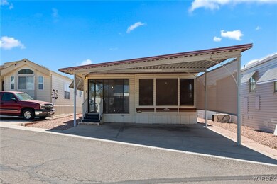 View of front facade with a carport