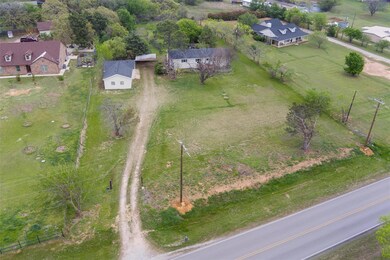 Birds eye view of property featuring a rural view