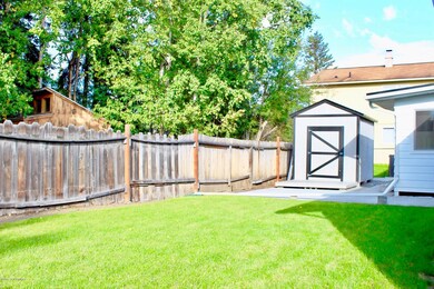 Level lawn and private fenced yard