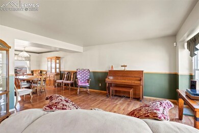 Living room with wood-type flooring