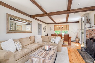 Another angle of the living room. Note the finished random width floor boards