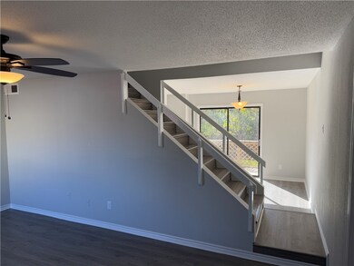 Stairway featuring hardwood / wood-style floors, a