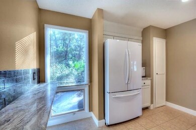 Sunny kitchen with newer appliances