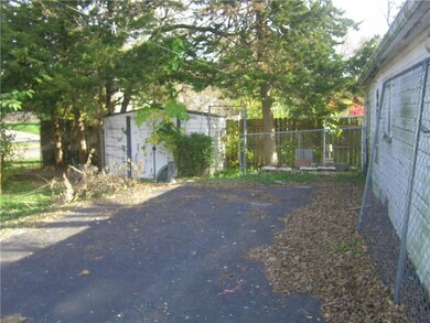 There is an extra parking pad next to the garage for a boat, camper or whatever you need.