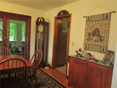 Dining room has slider to huge covered side porch.