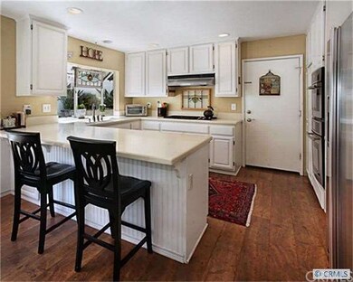 Kitchen has been refinished with white cabinetry a