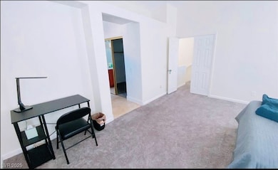Carpeted office featuring baseboards